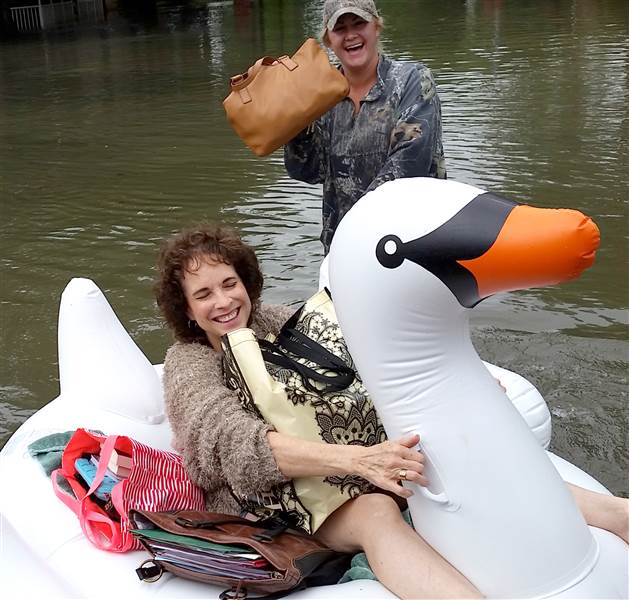 Midwife Rides Swan Floatie Through Flood to Deliver Baby